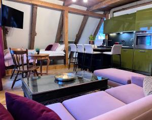 a living room with a couch and a table at Reval Residences Old Town in Tallinn +26 photos