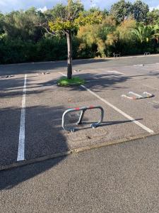 a parking lot with a bike rack on the side of a road at Studio Saint-Tropez Heraclée in Saint-Tropez