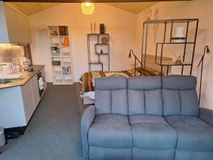 a living room with a couch and a bed at Quinta da Portela in Ferro