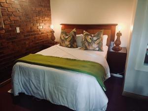 En eller flere senge i et værelse på Lapa Phanzi