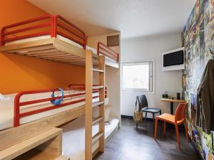 a bunk bed room with two bunk beds and a desk at hotelF1 Saint Witz A1 Hôtel in Saint-Witz