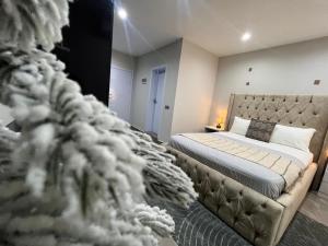 a bedroom with a large bed and a couch at Sylz Residence Studio in Accra