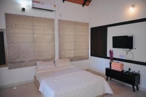 Et tv og/eller underholdning på Coffee Gudda Resort