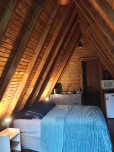 En eller flere senge i et værelse på Pousada Vale das Pedras 01