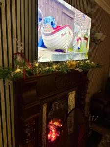a reflection of a boat on top of a fireplace at Katies Cottage in Gortaclare