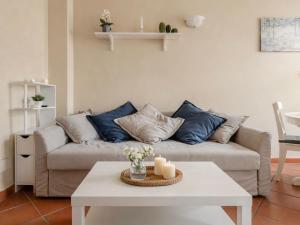 a living room with a couch and a table at Paradise Apartment, Comfort e Private Parking in Prato
