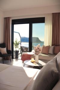 a hotel room with a view of the ocean at Anel Rooms in Himare
