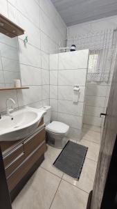 Phòng tắm tại Casa praia Itapeva, Torres