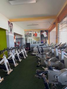 a gym filled with rows of exercise bikes at Case Africaine Confort Terrasse Accès Plage in Mbour
