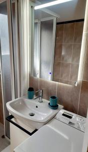 a bathroom with a sink and a mirror at Anchoveta in Calonge +12 photos