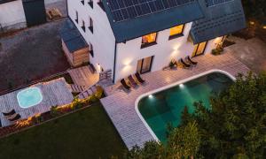 an overhead view of a house with a swimming pool at Szafran Home Spa in Korbielów