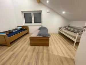 En eller flere senge i et værelse på Wohlfühloase