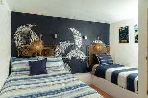 Postel nebo postele na pokoji v ubytování Trade Winds Restaurant & Guest House