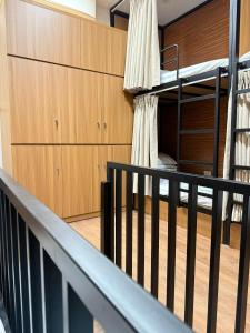 a staircase in a room with bunk beds at Peanut Stay Hostel in Hanoi +4 photos