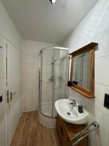 a bathroom with a sink and a shower at DoubleRoom in shared apartment 2nd floor in Linz am Rhein +20 photos
