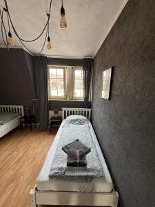 a bedroom with a bed in the corner of a room at DoubleRoom in shared apartment 2nd floor in Linz am Rhein