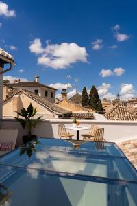a view from the roof of a house with a table and chairs at Las Amiras Homes Collection in Granada