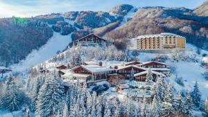 an aerial view of a resort covered in snow at Sunny Pine Apartment Mavrovo in Mavrovo