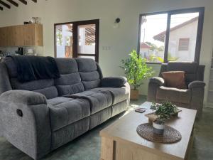 a living room with a couch and a coffee table at Farmer's house in El Quije