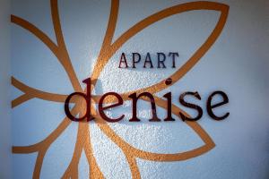 a part of a glass with the words part orange at Apart Denise in Fügen