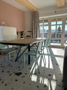 a dining room with a table and chairs at Brezový dvor in Svätý Anton