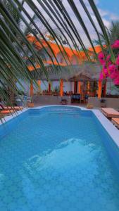 La alberca dentro o cerca de Hôtel évasion pêche djilor île sine saloum