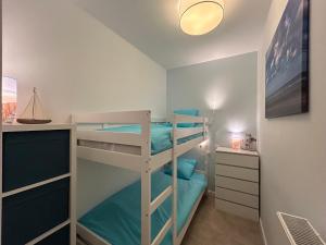 En eller flere senge i et værelse på Les Terrasses du Phare, vue mer, 100m plage, pkg, terrasses, accès PMR