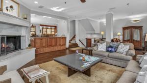 a living room with a couch and a table at Chalet Premio in Beaver Creek