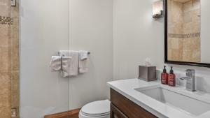 a bathroom with a sink and a toilet at Chalet Premio in Beaver Creek +22 photos