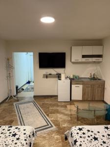 a living room with a tv on the wall at Stan na dan Berane in Berane