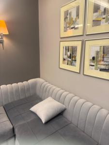 a white couch with a pillow on top of it at Veranda resort in Hurghada +1 photo