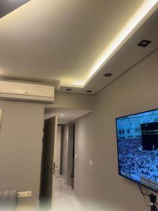 a room with a flat screen tv on a wall at Veranda resort in Hurghada