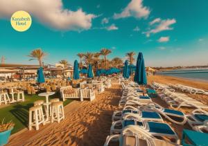 a row of chairs and umbrellas on a beach at kanabesh hotel in Sharm El Sheikh