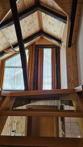 a view from the inside of a room with two windows at Holiday Home BIBA With Heated Outdoor Pool in Gornja Stubica