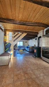 a large living room with a couch and a stove at Holiday Home BIBA With Heated Outdoor Pool in Gornja Stubica