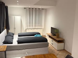 TV a/nebo společenská místnost v ubytování Sunside Apartments