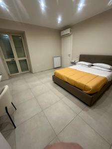 a bedroom with a large bed in a room at Souad 2 in San Prisco