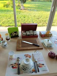 a table with a tea set on a table at Ferme de Bopérec in Nostang