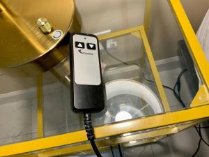 an iphone with a face drawn on it plugged into a machine at Beautiful Days in Orange Park