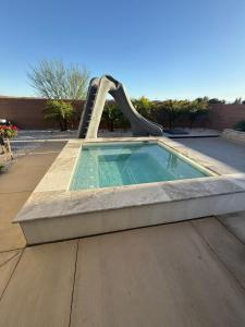 a small pool with a slide in a playground at Luxe relax in Washington