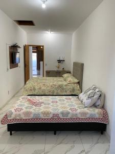 Postel nebo postele na pokoji v ubytování Kitnet Centro da Cidade