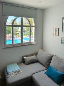 Khu vực ghế ngồi tại Tavira Happy Stay