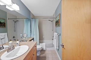 a bathroom with a sink and a toilet and a shower at 2 Bedroom Condo Banff, Canmore sleeps 6 comfortably in Canmore +44 photos