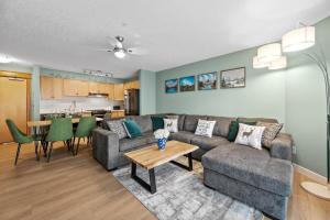 a living room with a couch and a table at 2 Bedroom Condo Banff, Canmore sleeps 6 comfortably in Canmore