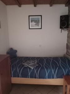 En eller flere senge i et værelse på Ferme de Bopérec + 2 billeder