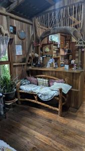a bedroom with a large wooden bed in a room at Landscape-Cabaña winter full equipada in La Cruz