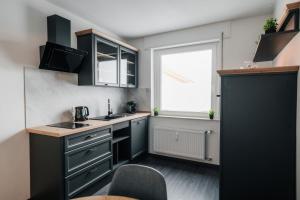 Kuchyň nebo kuchyňský kout v ubytování RandHome Apartment Erwitte Horn