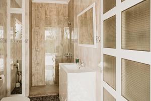 a bathroom with a white sink and a shower at Villa alegre in Elche +40 photos