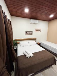 En eller flere senge i et værelse på Casa O Segredo da Alma