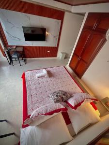 En eller flere senge i et værelse på Wiky House Guaduas